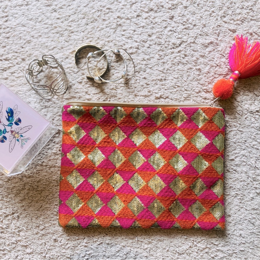 Anthropologie sequin and embroidery clutch 9” x 7” zip closure, tassel end